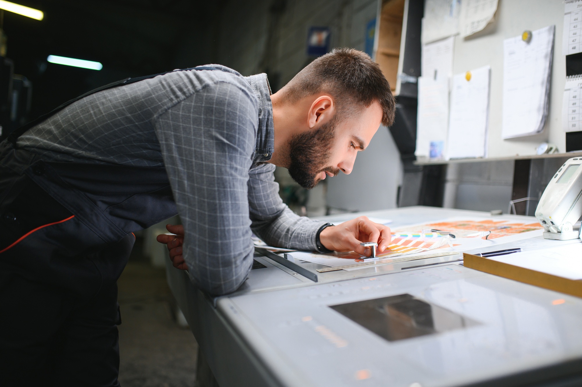 Printing house interior with modern offset print machine